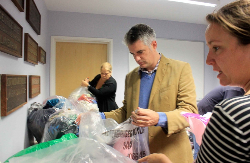 James Cartlidge Joins the Sudbury Team Sorting Donations
